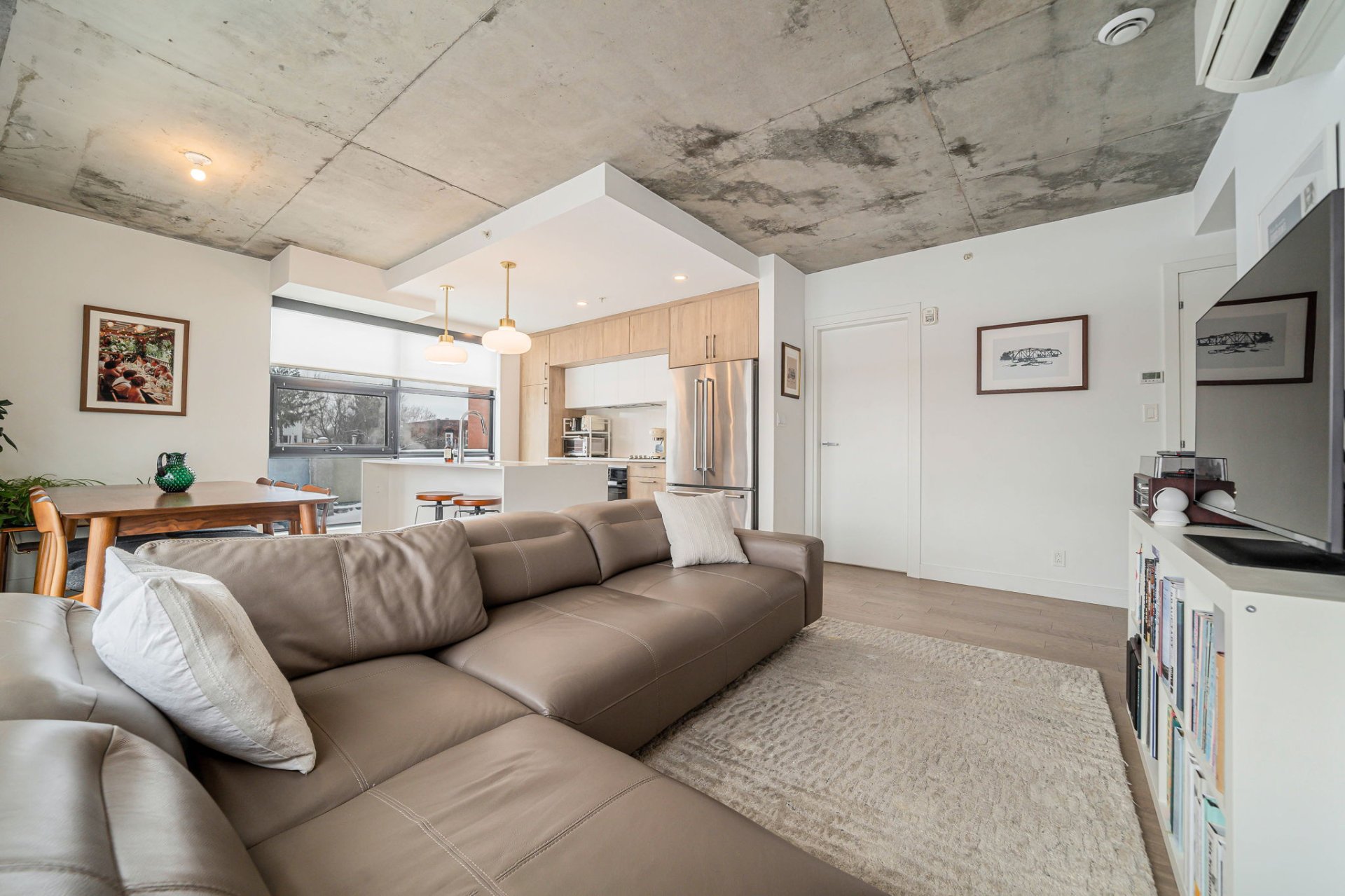 Open-concept living and dining space at Montreal condo 2615 Rue Augustin-Cantin unit A201